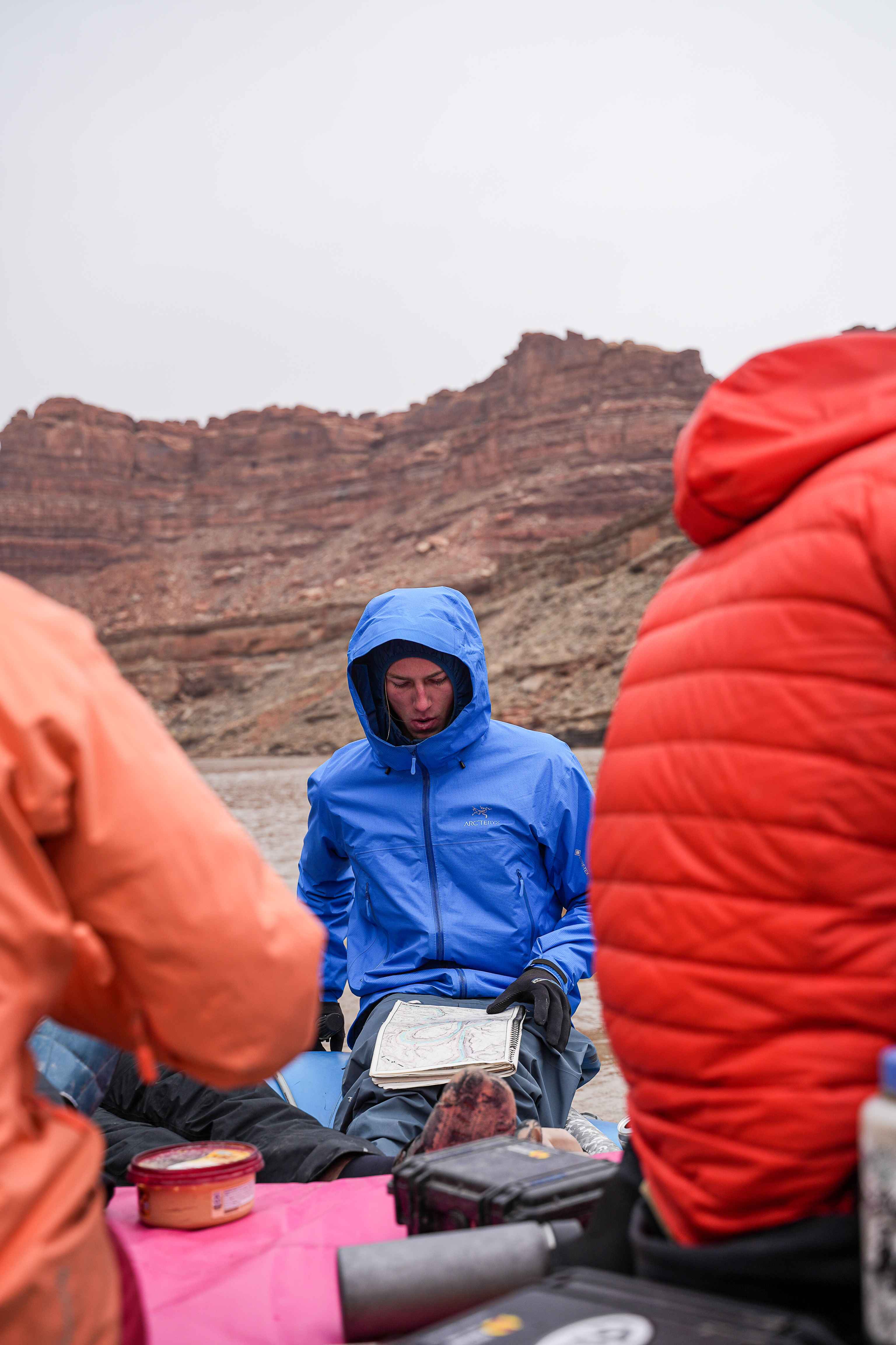 Reading a map on a river trip through the Southwest — a Creative Flow Studio frame.
