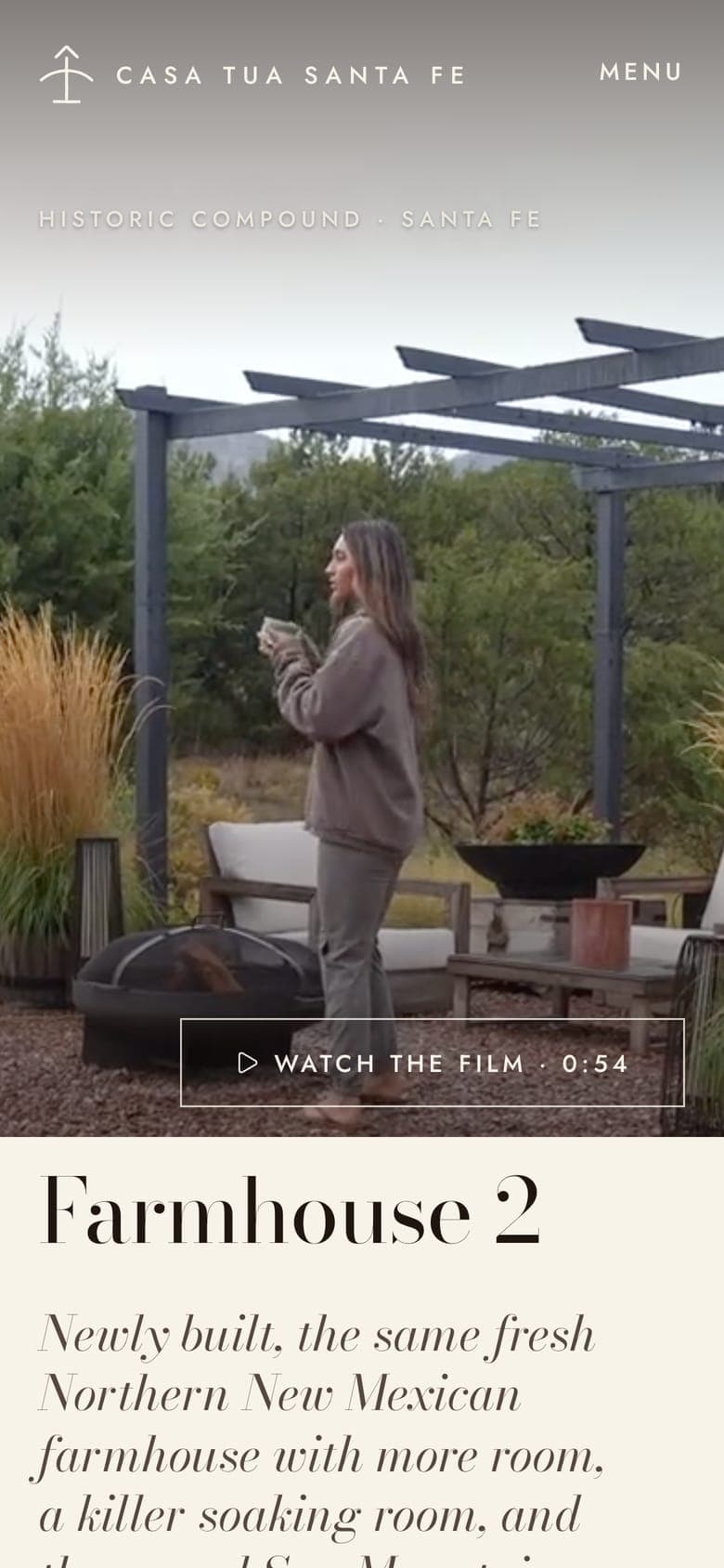 The Farmhouse 2 page on a phone: the film of a woman at the pergola and the home's name below
