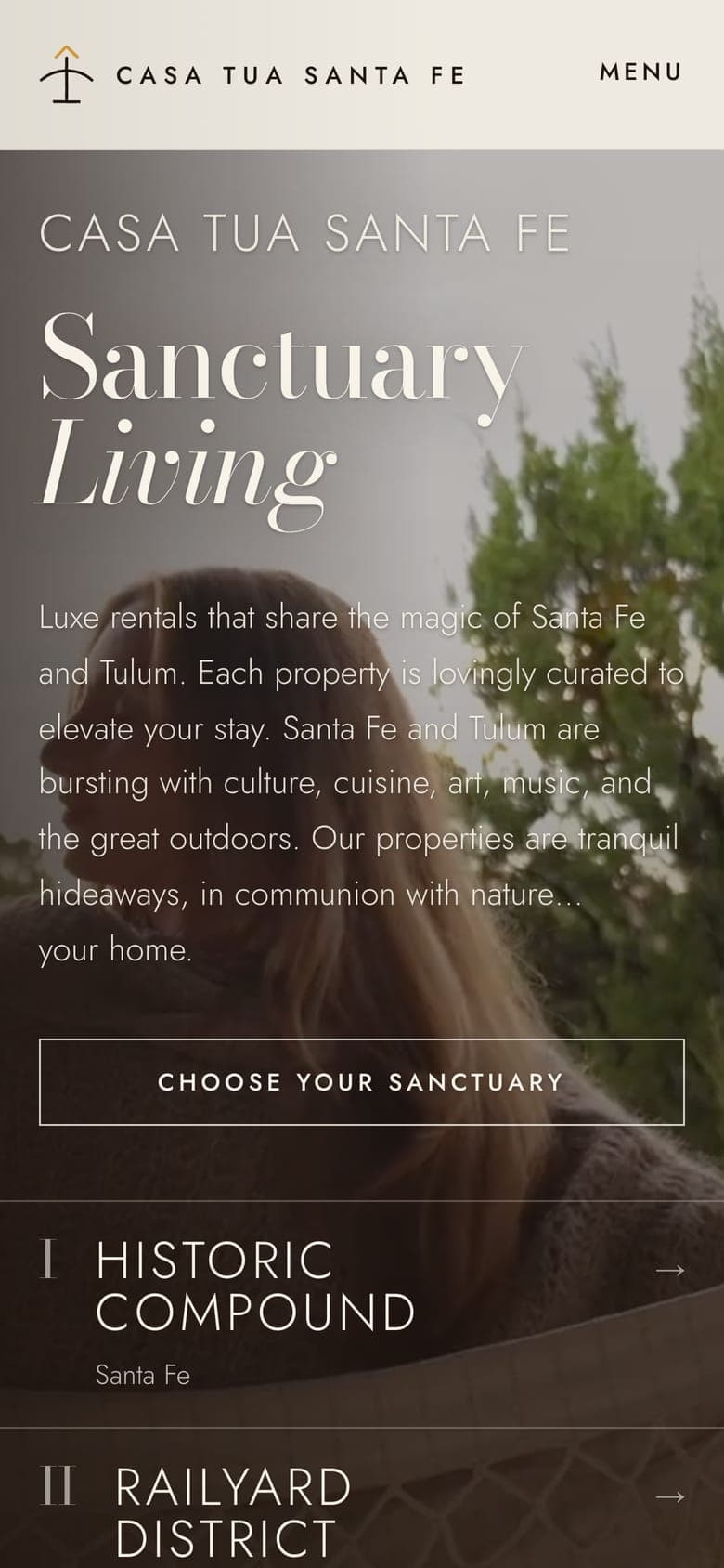 The homepage on a phone: Sanctuary Living over the opening film, with the first two neighborhoods below