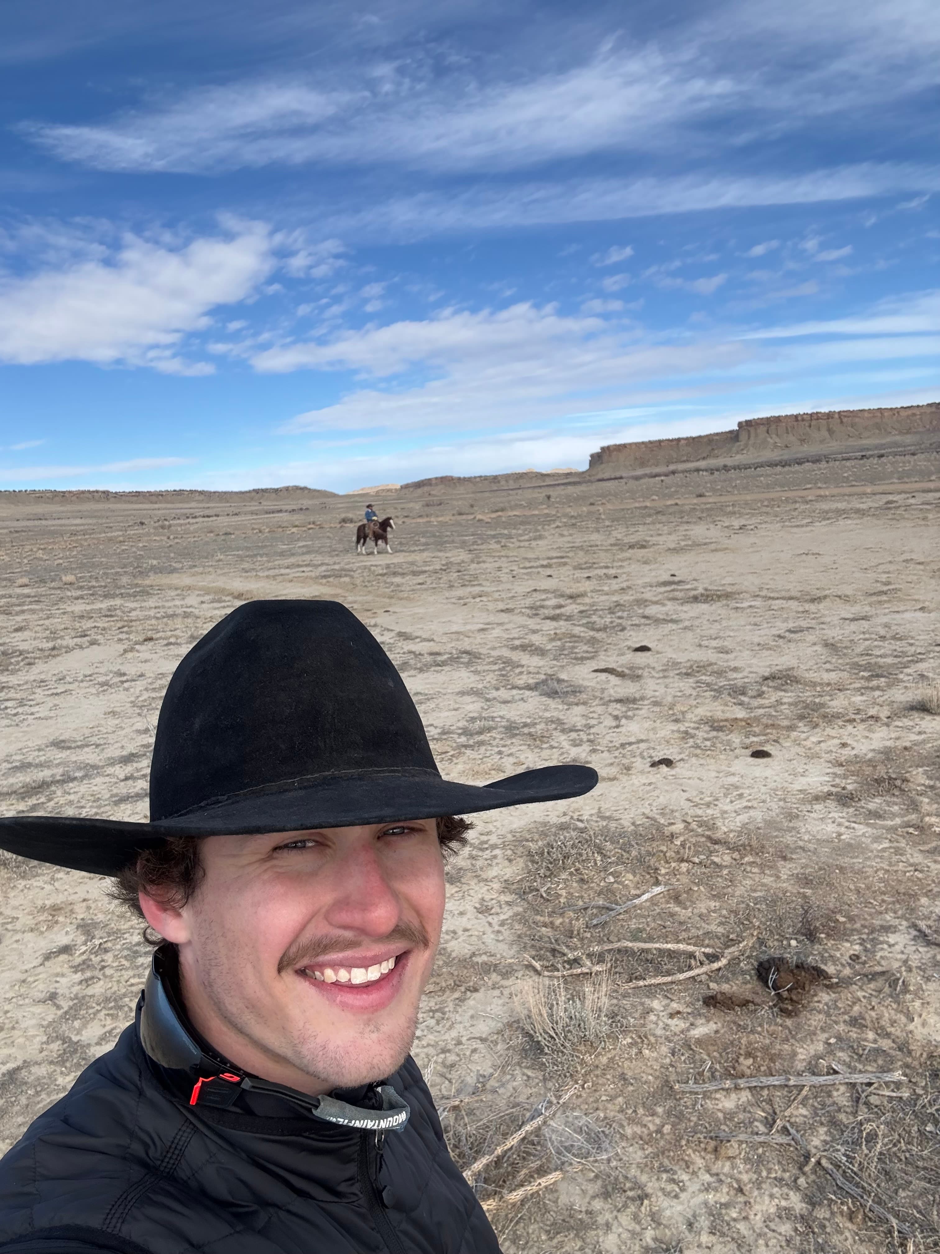 Wes on the ranch — camera in hand, in the work rather than on the edge of it.